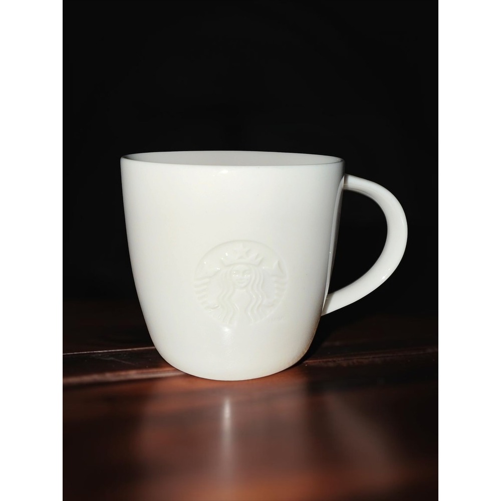 Starbucks 2010 Embossed Siren Logo White Ceramic Coffee Mug Letter S Handle